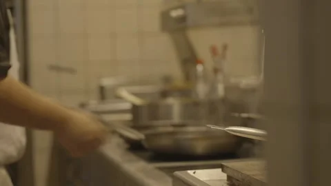 Medium shot chef stirring pans and pot 스톡 동영상 336173901