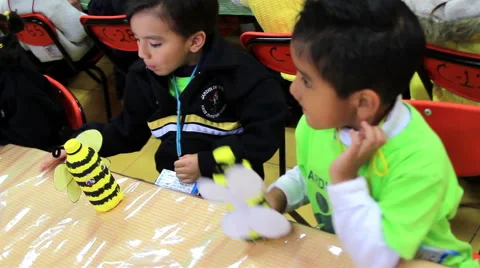 MEDIUM SHOT. Children  doing school activities in the kindergarten. Stock Footage 48432586