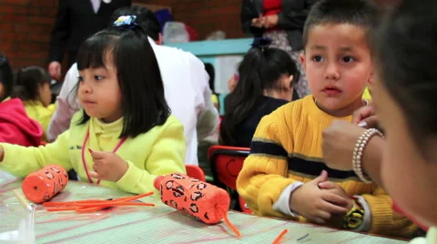 MEDIUM SHOT. Children  doing school activities in the kindergarten. Stock Footage 48436602