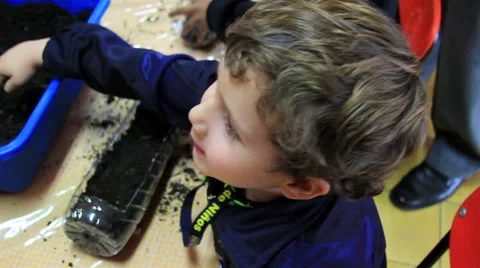 MEDIUM SHOT. Children doing school activities in the kindergarten. Stock Footage 48496333