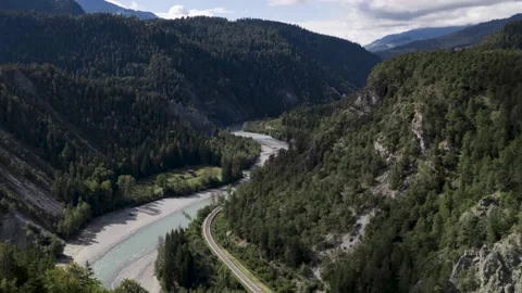 Medium shot of clouds and train passing by in the rhine ravine, timelapse. Stock Footage 163109341