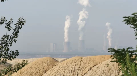 Medium shot of coal powered plant and cooling towers Stock Footage 65176762