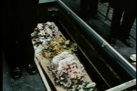 Medium shot of coffin lowered into grave Stock-Footage 11346300