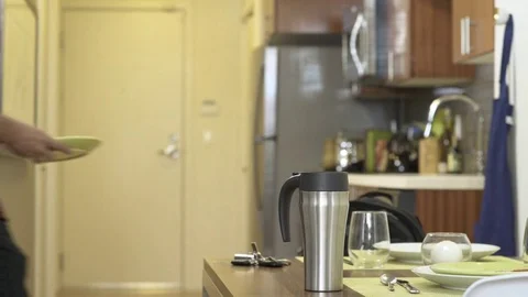 Medium shot of a couple leaving home in a hurry Stock Footage 76540600
