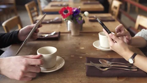 Medium shot of a couple sitting in a restaurant Stock-Footage 73291619