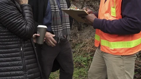 Medium shot of a couple talking to a worker 스톡 동영상 73251642