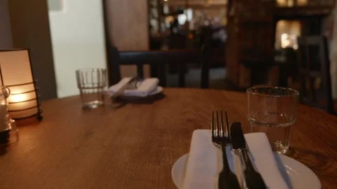 Medium shot of cutlery and empty place at pub restaurant table Stock Footage 330846317