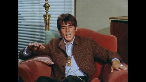 Medium shot of Davy Jones talking about class distinction in Britain, UK 1968 Stock Footage 133274620