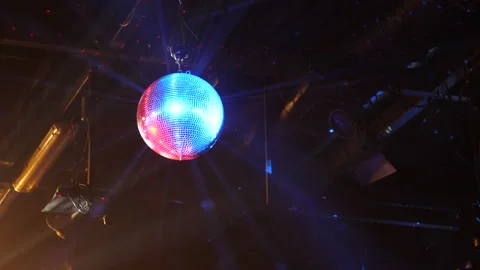 Medium shot of a disco ball reflecting light spinning in a nightclub, 4k Stock-Footage 134605690