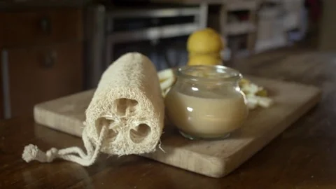 Medium shot dolly of homemade lemon detergent in kitchen background Stock Footage 73577971