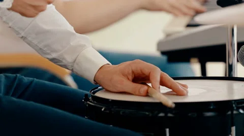 Medium shot drummer playing drums with drumstick Stock Footage 66441658