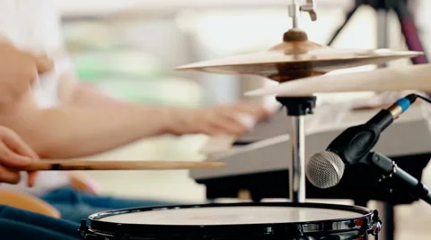 Medium shot drummer playing drums with drumstick Stock Footage 66441686