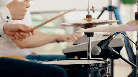 Medium shot drummer playing drums with drumstick Stock Footage 66441777