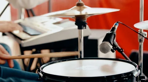 Medium shot drummer playing drums with drumstick Stock Footage 66441896