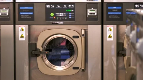 Medium shot of a dryer at a laundry facility. Stock Footage 88375007