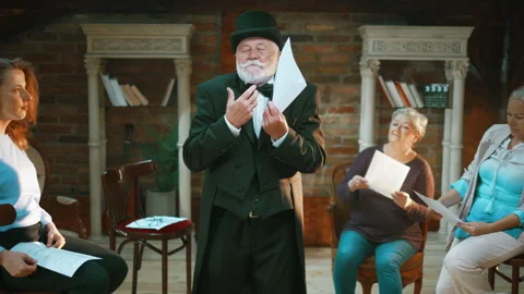 Medium shot of an elderly actor rehearsing a scene in a theater Stock Footage 247494841