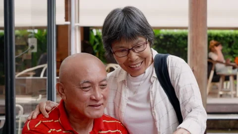 Medium Shot, elderly Asian couple, man with woman, they all went out relax .. Stock Footage 286236420