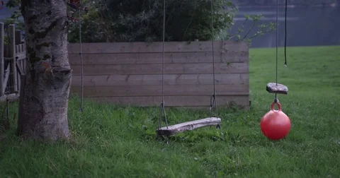 Medium Shot of Empty Swings In Park Stock Footage 83482253