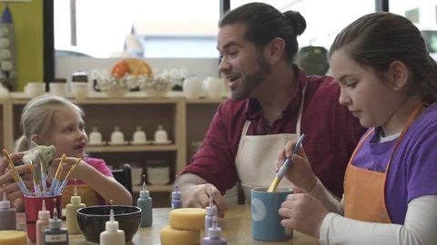 Medium shot of a family in a ceramic studio 動画素材 73291997