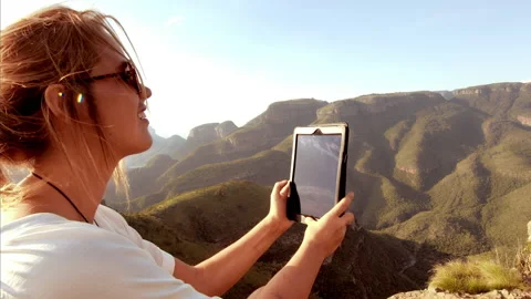 Medium shot of Female using banking app on touch screen tablet computer with epi Stock Footage 199617167