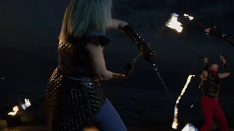 Medium shot of five fierce fire artists of mixed-gender performing together Stock Footage 144749229