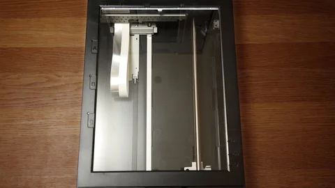 Medium shot of a flatbed scanner at work. Stock Footage 113571942