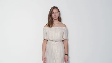 Medium Shot of A Fresh-Faced Model Looking Her Watch and Fixing Her Dress 스톡 동영상 116914998