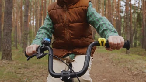 Medium shot front view boy cycling outdoor training Stock Footage 316581555