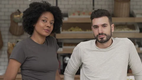 Medium shot front view of two young entrepreneurs confidently looking at camera Stock Footage 277957561