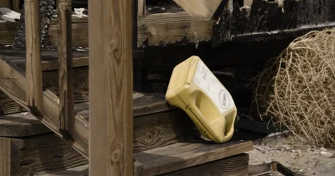 Medium Shot of Gas Can to Details of Burnt Home Stock Footage 89941719