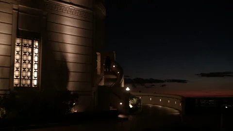 Medium shot Griffith Observatory exterior walls and illuminated staircase Stock Footage 329170238
