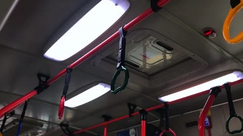 Medium shot of handles hanging on moving train Stock Footage 290879294