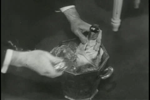 Medium shot of hands opening champagne bottles Stock Footage 11356036