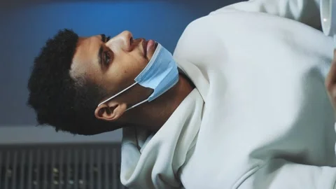 Medium shot of Handsome multiracial man drinking a cup of coffee and working on Stock-Footage 131532541