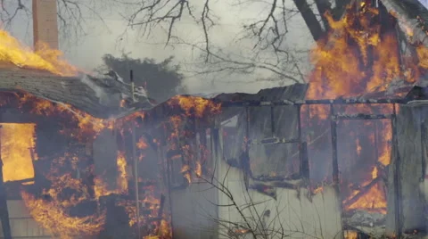 Medium shot of house almost collapsed from fire Stock Footage 61180010