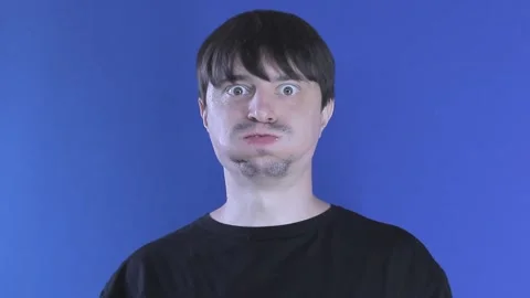 Medium shot hungry guy eats a burger greedily. Unhealthy food Stock Footage 137970830