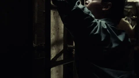 Medium shot of an inmate breaking out of prison, USA, 1960s - Reenactment 스톡 동영상 238866832
