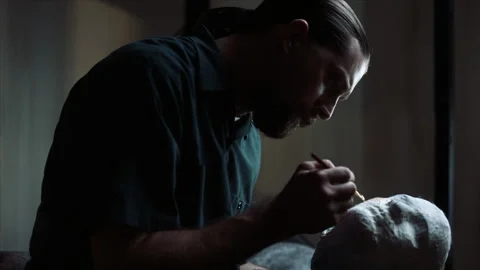 Medium shot of inmate in jail cell making decoy, 2000s, USA - Reenactment 스톡 동영상 243736727