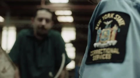 Medium shot of inmate talking to guard, 2000s, USA - Reenactment 스톡 동영상 243737525