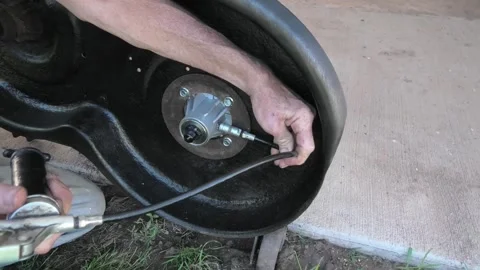 A Medium-Shot of Lawnmower Deck Maintenance Stock Footage 293619648