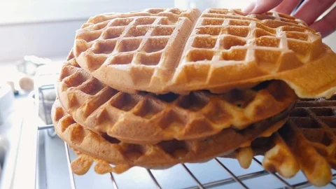 Medium Shot of Lifting a Belgian Waffle from a Stack and Putting it Back in 4k Stock Footage 86485910