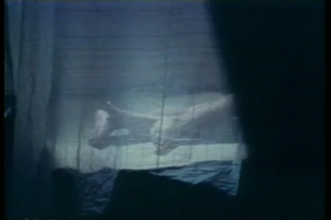 Medium shot of lovers'  feet behind curtain Vídeos de archivo 11354909