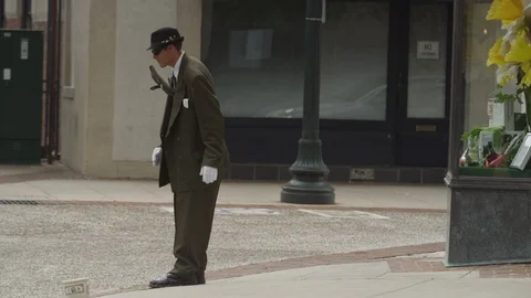 Medium shot of magician performing tricks in downtown Asheville, NC Stock Footage 103430672