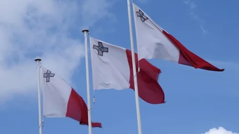 Medium shot of Malta's waving flags Stock Footage 90309710