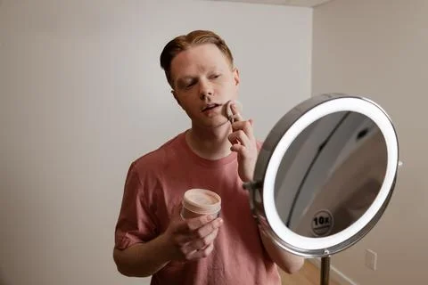 A Medium Shot Of A Man Applying Powder Makeup Mirror Beauty Routine Stock Photos