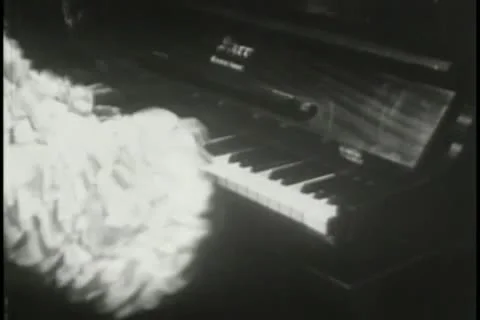 Medium shot of man in costume playing piano 스톡 동영상 11356020