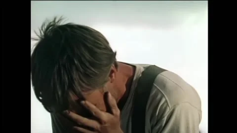 Medium shot of man covering his face and crying, 1950s Stock Footage 260259161