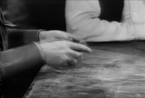 Medium shot of man dealing cards to poker players, 1930s Видео 95348281