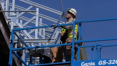 Medium Shot Man On Lift Lights Cigarette Construction Stock Footage 86873553