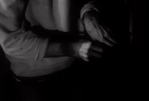 Medium shot of man picking and opening lock, 1950s Stock Footage 95348317